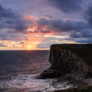 A beautiful evening view of Nash Point and the beach and ocean at high tide near to Wagon House Holiday Cottages as the sun goes down. Wagon House Holiday Cottages are in the beautiful Vale of Glamorgan, Wales. The converted holiday cottages are situated in a quiet village only 10 minutes walk from the sea.