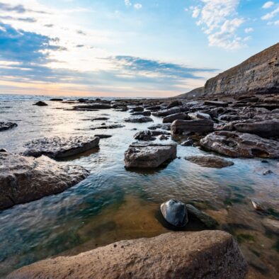 A view of the beach and ocean at low tide near to Wagon House Holiday Cottages. Wagon House Holiday Cottages are in the beautiful Vale of Glamorgan, Wales. The converted holiday cottages are situated in a quiet village only 10 minutes walk from the sea.